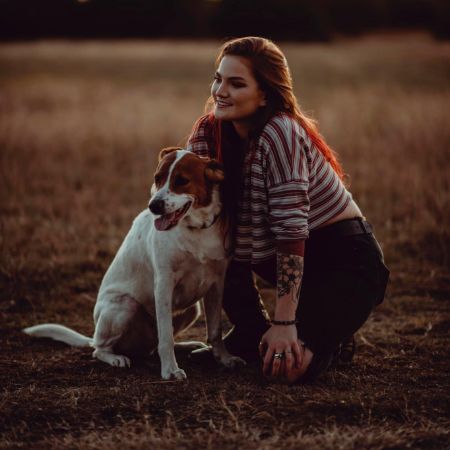 Layla LaCosta Laseter took a picture with her pet dog in the field.